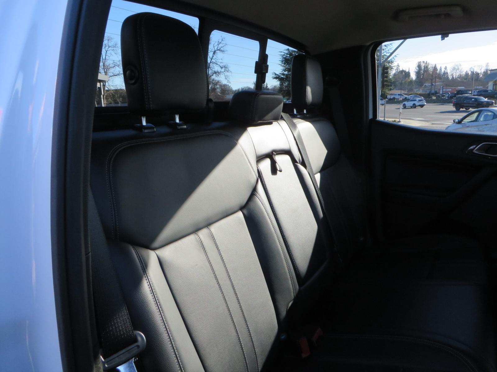 2019 White /Black Ford Ranger Lariat (1FTER4FHXKL) with an 2.3L engine, automatic transmission, located at 2630 Grass Valley Highway, Auburn, CA, 95603, (530) 508-5100, 38.937893, -121.095482 - Features a Fabtech suspension system, Fuel Offroad wheels, Nitto Ridge Grappler tires, Westin Running boards, and a Bakflip. - Photo #50